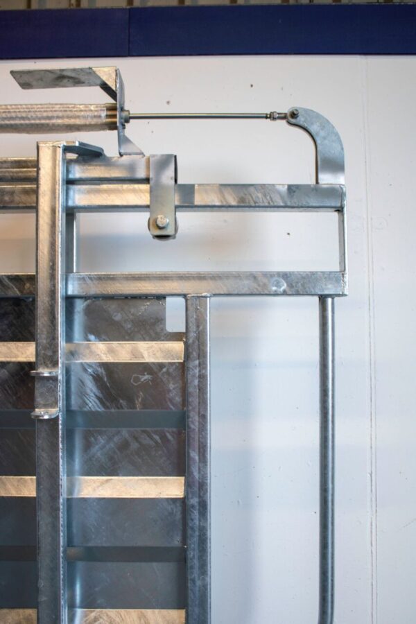 Close up of air slide gate for cattle crush - animal handling system